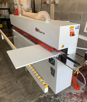 Expert craftsman assembling bespoke kitchen units